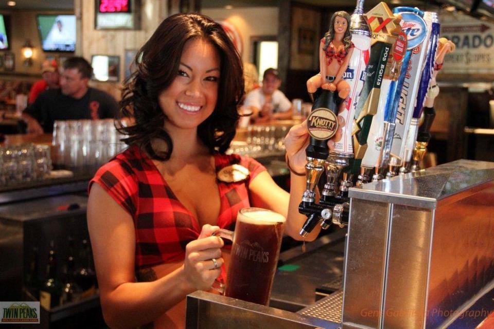 Waitress serving beer at Twin Peaks