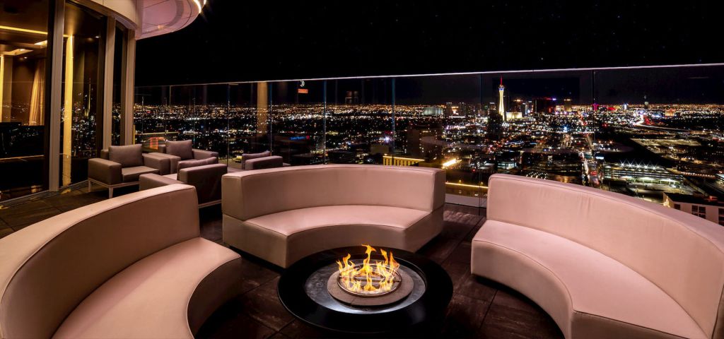 Legacy Club rooftop fire pit and Las Vegas skyline at night