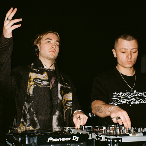 Prospa performing together behind the DJ decks