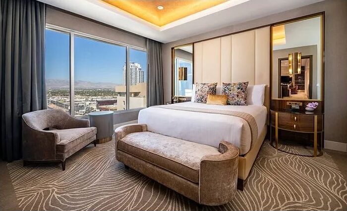 Bedroom and Strip view in a Marra Tower suite at SAHARA Las Vegas
