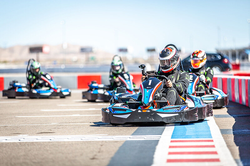 Drivers racing outdoor go karts at SPEEDVEGAS