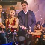 Friends celebrating with nightclub bottle service in Las Vegas