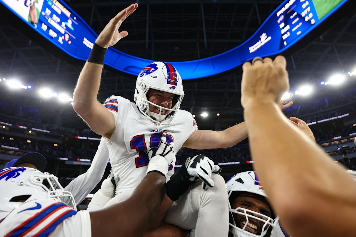 Tyler Bass is lifted by teammates after his winning overtime kick against the Rams on October 12, 2026.